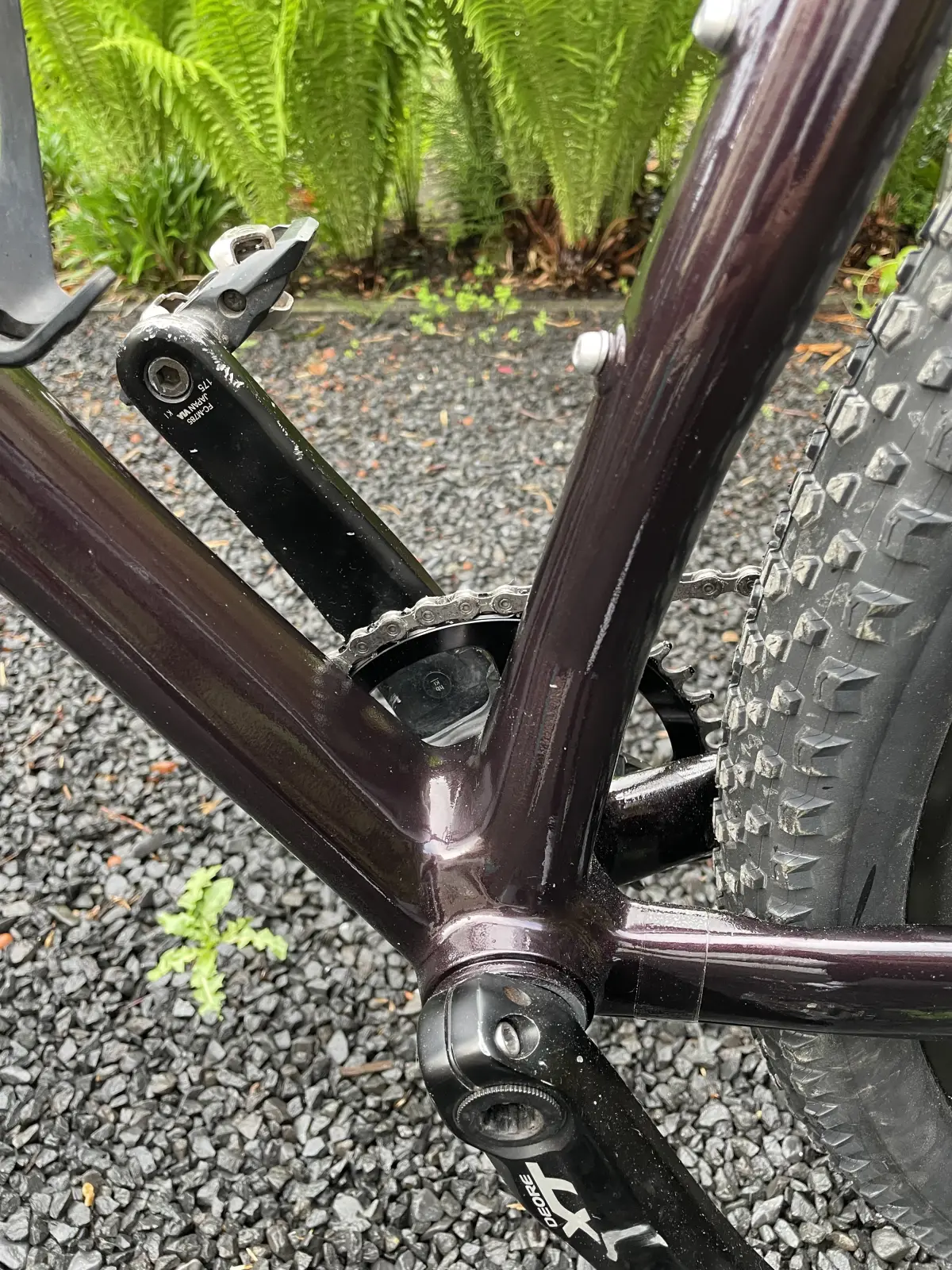 Bottom bracket area, non-drive side, painted Montana Black where the external brake mounts used to be
