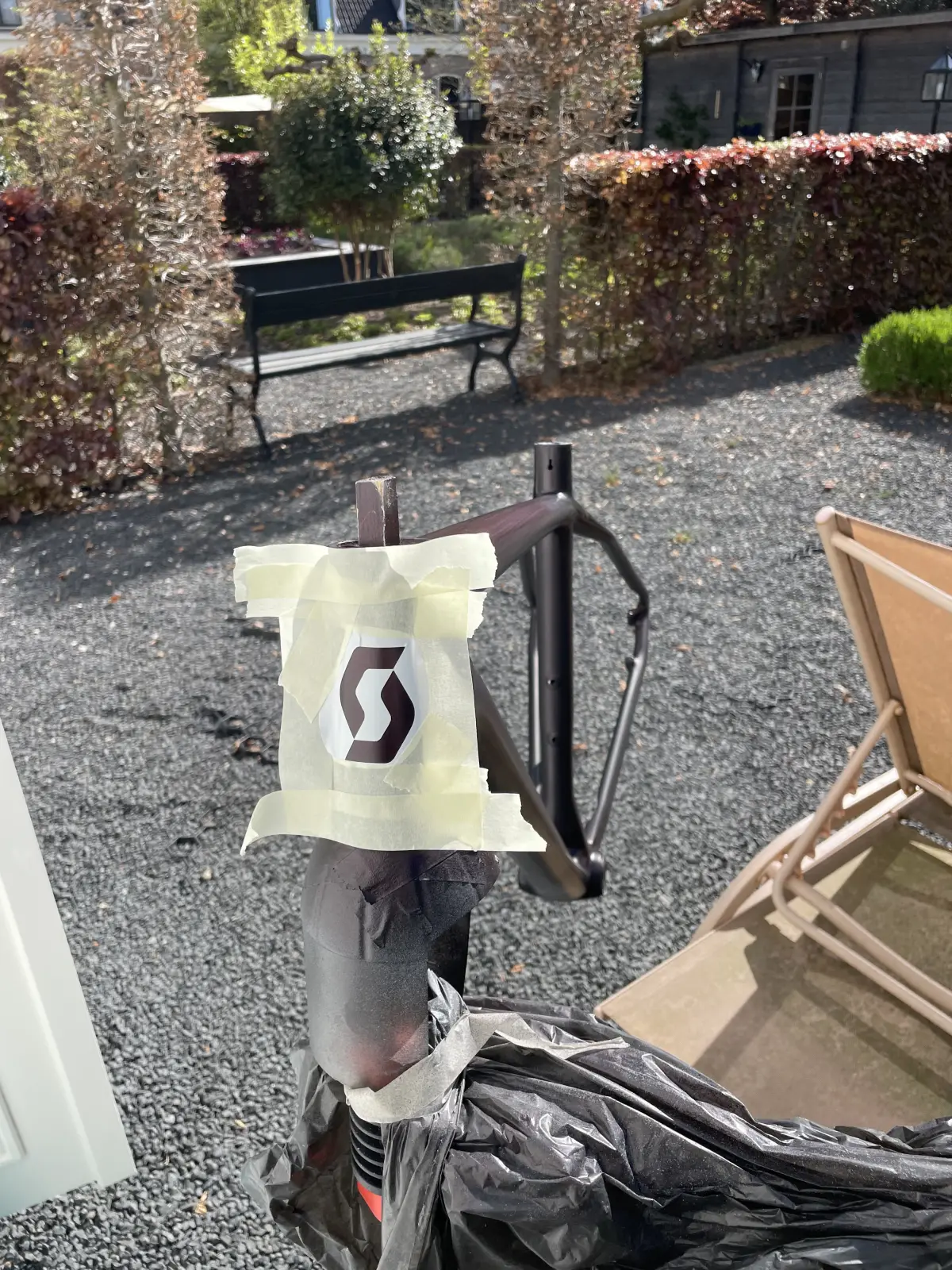Scott S-icon stencil taped onto the head tube