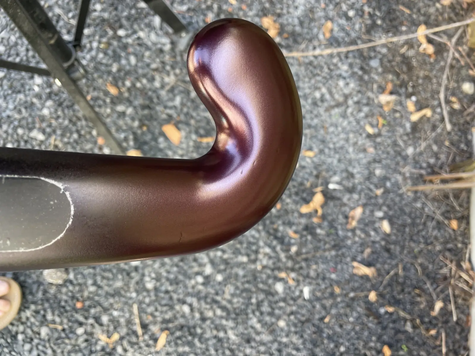 Hockey stick with cherry red metallic spray